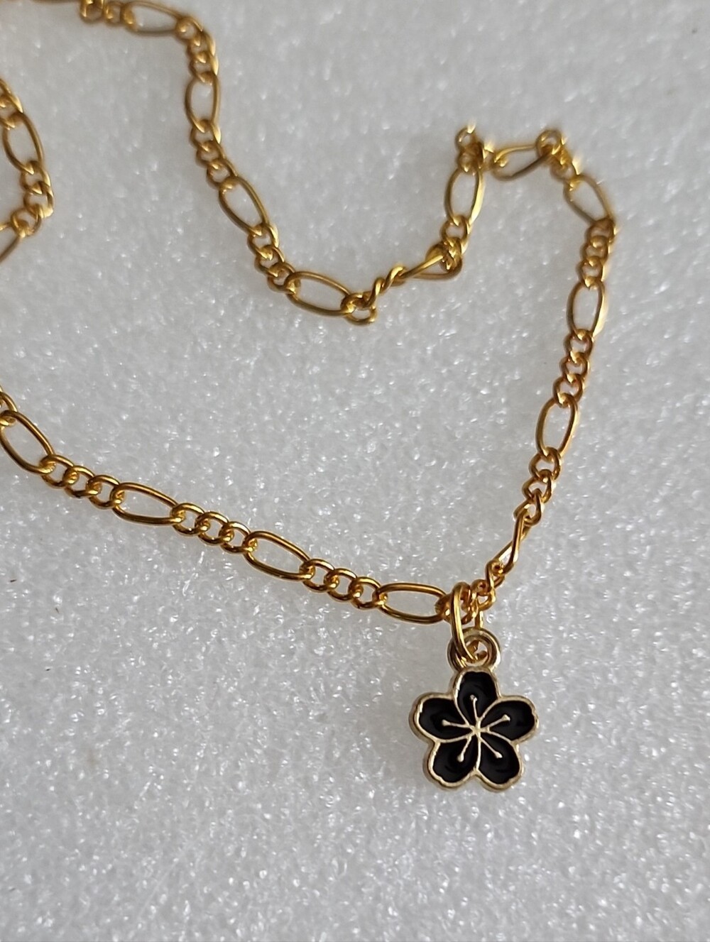 Hand Crafted Gold Bracelet with Black Flower Charm